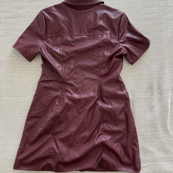 TOCCIN Faux Leather Short Sleeve Dress
Burgundy Faux Leather Button-Up Dress - Picture 7 of 8